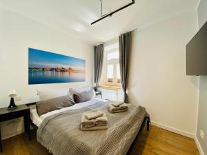 Postel nebo postele na pokoji v ubytování HafenCity App No 1