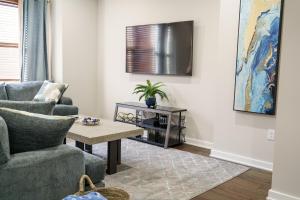 a living room with a couch and a table at Hidden Gem 2 in Norristown