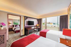 Voodi või voodid majutusasutuse Hotel Riviera Macau toas