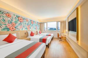 Voodi või voodid majutusasutuse Hotel Riviera Macau toas