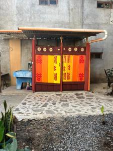 a colorful gate in front of a building at Cabaña del Ciprés interior in San Pedro La Laguna