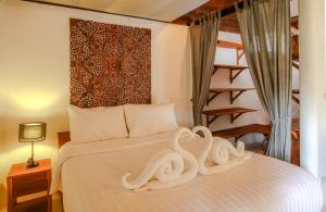 Postel nebo postele na pokoji v ubytování Amaya Boutique Resort