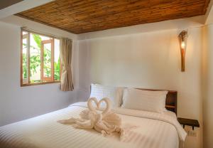 Postel nebo postele na pokoji v ubytování Amaya Boutique Resort + 37 fotografií