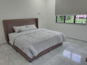 Ένα ή περισσότερα κρεβάτια σε δωμάτιο στο Ap Classic Rest House
