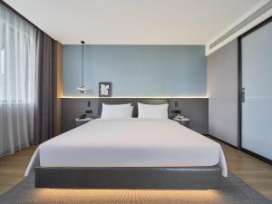 Ліжко або ліжка в номері Country Inn&Suites By Radisson, Xi'an Bell and Drum Tower Flagship
