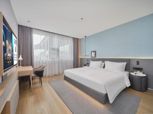 Ліжко або ліжка в номері Country Inn&Suites By Radisson, Xi'an Bell and Drum Tower Flagship