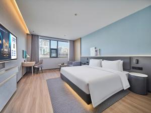 Телевізор і / або розважальний центр в Country Inn&Suites By Radisson, Xi'an Bell and Drum Tower Flagship