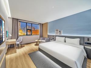 Ліжко або ліжка в номері Country Inn&Suites By Radisson, Xi'an Bell and Drum Tower Flagship