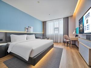 Ліжко або ліжка в номері Country Inn&Suites By Radisson, Xi'an Bell and Drum Tower Flagship
