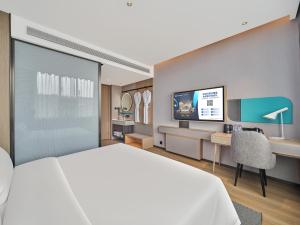 Телевізор і / або розважальний центр в Country Inn&Suites By Radisson, Xi'an Bell and Drum Tower Flagship