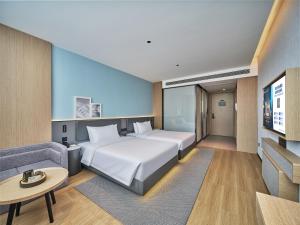 Ліжко або ліжка в номері Country Inn&Suites By Radisson, Xi'an Bell and Drum Tower Flagship