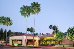 a palm tree in front of a hotel at Courtyard by Marriott Los Angeles Hacienda Heights Orange County in Hacienda Heights
