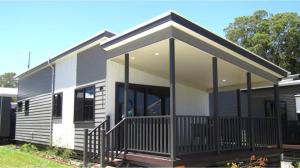 a rendering of a house with a porch at Discovery Parks - Forster in Tuncurry