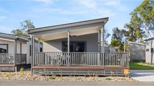 a modular home with a porch at Discovery Parks - Forster in Tuncurry