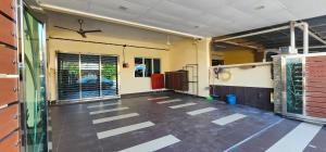 an empty room with a ceiling fan in a building at Cozy homestay Bendahara in Kuala Selangor +11 photos