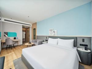 Ліжко або ліжка в номері Country Inn&Suites By Radisson, Xi'an Bell and Drum Tower Flagship