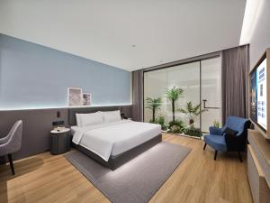 Ліжко або ліжка в номері Country Inn&Suites By Radisson, Xi'an Bell and Drum Tower Flagship