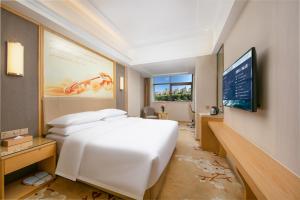 Televiisor ja/või meelelahutuskeskus majutusasutuses Vienna Hotel Xi'an Hancheng Lake Old City