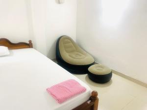 Postel nebo postele na pokoji v ubytování Bloom Guest House