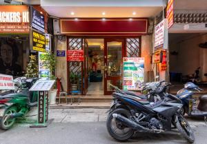 a group of motorcycles parked in front of a store at Hanoi Capital Hotel & Spa in Hanoi