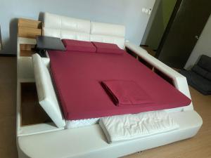 a white couch with a table in a living room at Sandakan Js homestay in Sandakan +6 photos