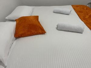 En eller flere senge i et værelse på Casa Carolina