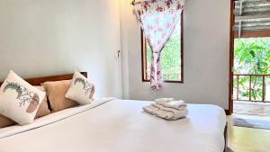 Postel nebo postele na pokoji v ubytování Pai Flora Resort