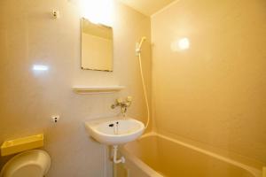 a bathroom with a sink and a toilet and a tub at クリステート601-Crystate 601- in Kyoto