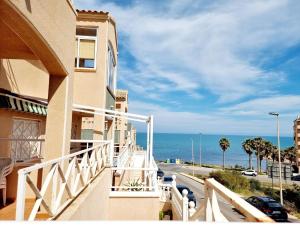 a balcony of a building with a view of the ocean at Dream Bungalow with Sea Views at La Mata Beach in Torrevieja