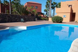 Fotografia z galérie ubytovania Oasis Royal 2 Dormitorios Piscinasfibra Optica v destinácii Corralejo