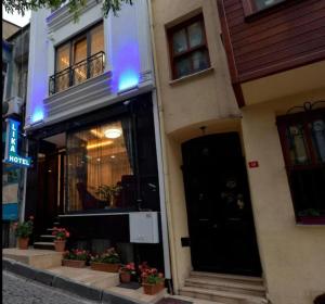 a store front of a building with a black door at Lika Hotel - Standard Double or Twin Room in Istanbul +7 photos