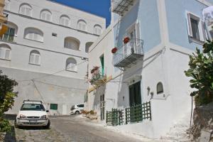 a car parked on a street next to a building at Maridea - Marlin in Ponza +7 photos