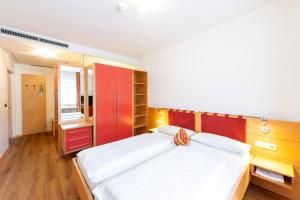 Postel nebo postele na pokoji v ubytování Hotel Figl ***S