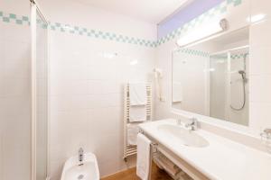 Koupelna v ubytování Hotel Figl ***S