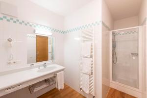 Koupelna v ubytování Hotel Figl ***S