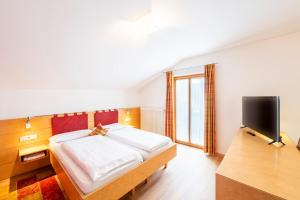 Postel nebo postele na pokoji v ubytování Hotel Figl ***S