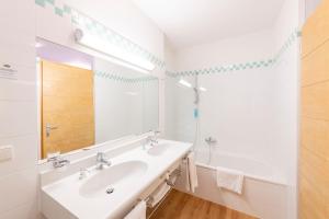Koupelna v ubytování Hotel Figl ***S