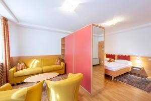 Postel nebo postele na pokoji v ubytování Hotel Figl ***S