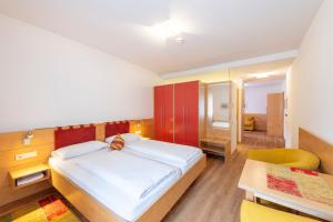 Postel nebo postele na pokoji v ubytování Hotel Figl ***S