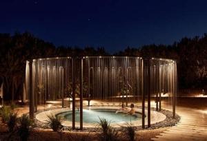 a pool with two people playing in it at night at Rye Haven Coastal Escape in Rye