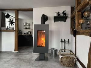a wood burning stove in a room with at Altes Grabenhöfchen - 5 Sterne Ferienhaus in Stetten