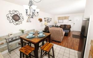 a kitchen and living room with a table and chairs at Oak Square 305 in Gatlinburg