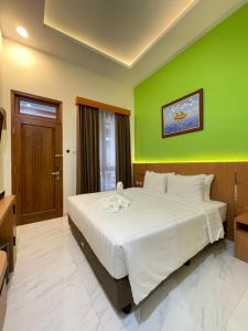 Ένα ή περισσότερα κρεβάτια σε δωμάτιο στο The Cabin Hotel Lovina Bali +60 φωτογραφίες