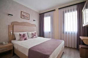 Postel nebo postele na pokoji v ubytování Artefes Hotel Old City