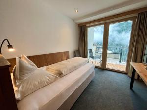 Posteľ alebo postele v izbe v ubytovaní Hotel Post Kappl