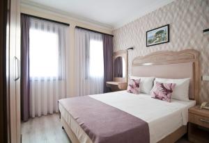 Postel nebo postele na pokoji v ubytování Artefes Hotel Old City