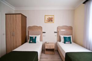 Postel nebo postele na pokoji v ubytování Artefes Hotel Old City