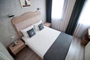 Postel nebo postele na pokoji v ubytování Artefes Hotel Old City