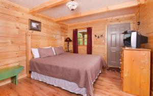 En eller flere senge i et værelse på Mountain Breeze