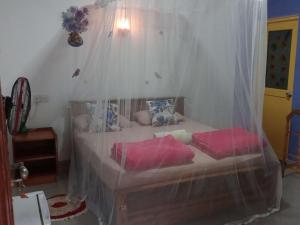 A bed or beds in a room at Littleadems View